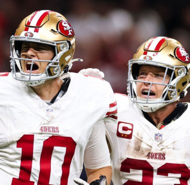 QB Mac Jones y RB Christian McCaffrey. Foto: Sean Gardner/Getty Images